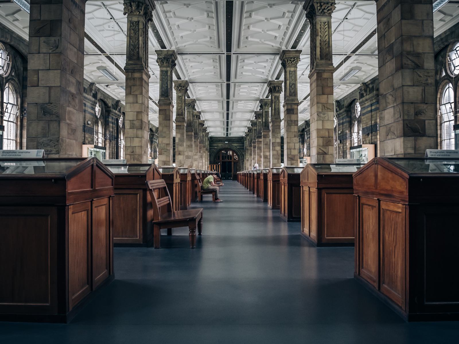 A long reading hall with wooden desks